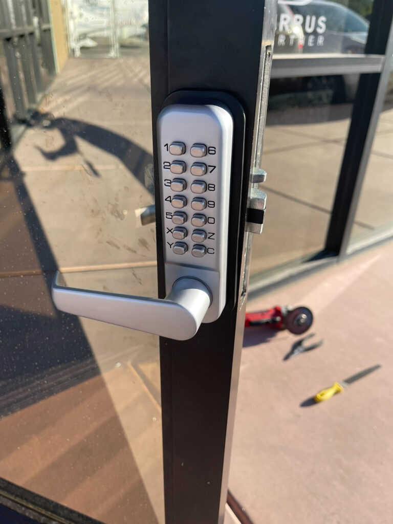 Mechanical keypad lock on a business storefront door in Las Vegas NV