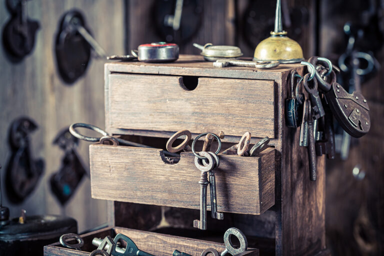 Vintage locksmiths workshop with locks and tools. Ancient locksm